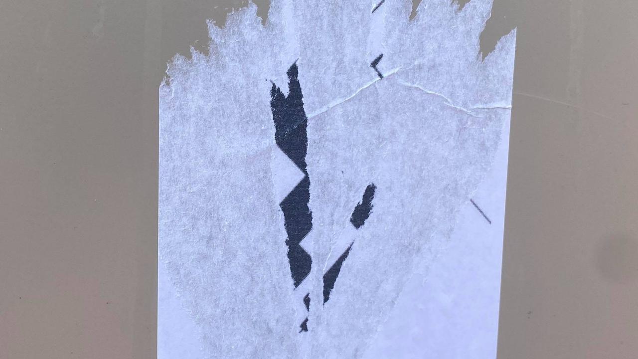 This was all that was left of the offensive sticker after Jayde Maher attempted to remove it on Monday. A swastika is clearly depicted, with the needle of a syringe, believed to be a covid vaccine, visible.