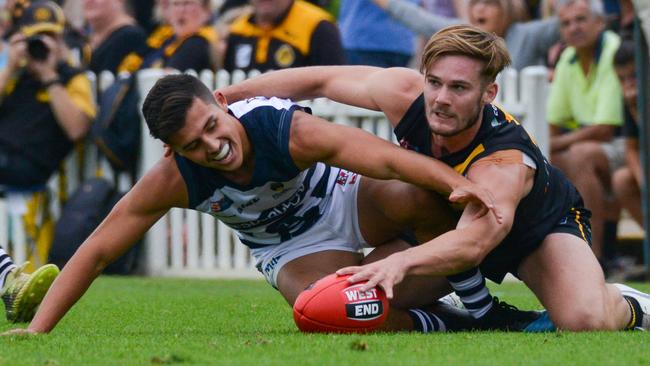 South's Hayden Sampson and Glenelg's Jonty Scharenberg scrap for the footy. Picture: AAP/Brenton Edwards