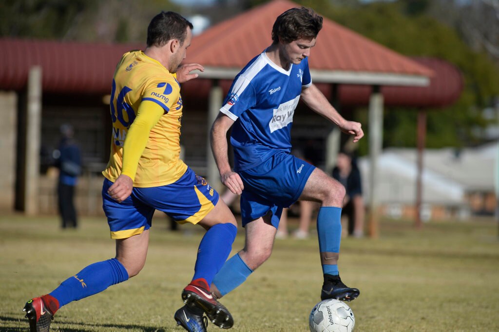 Nick Taylor (left) of USQ FC and Brodie Simpson of Rockville in Toowoomba Football League Premier Men round 14 at Captain Cook Reserve Des McGovern oval, Sunday, June 24, 2018. Picture: Kevin Farmer