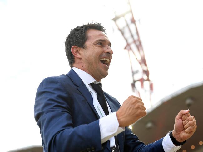 Paul Okon celebrates a win for the Mariners last season (AAP Image/Paul Miller)