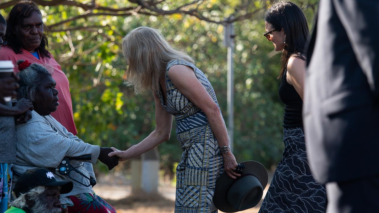 Coroner Elisabeth Armitage shakes hands with Ngeygo’s older sister Mary Malbiynga after her family invited the coronial inquest to take part in a ceremony at Mindil Beach, where on December 23 2019 her sister was killed by Garsek Nawirridj. Picture: Pema Tamang Pakhrin