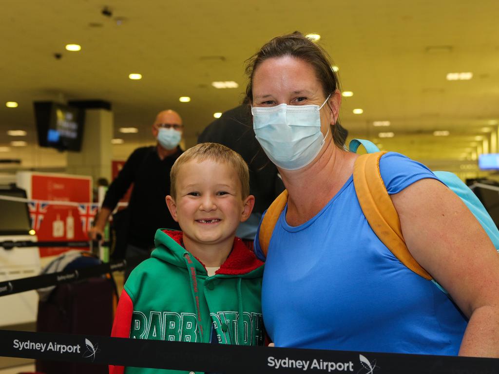 Carolyn Chambers and her son Ephraim arrive at Sydney International Airport to check in to depart. Picture: Gaye Gerard / NCA Newswire