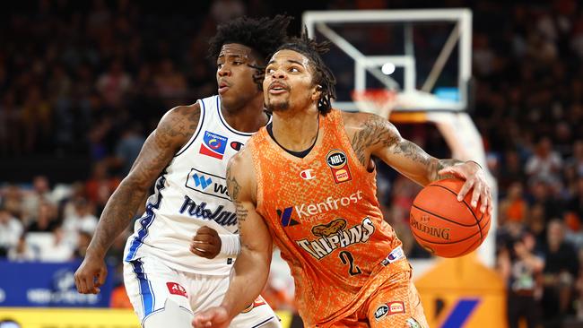 Adelaide's Kendric Davis and Taipans' Rob Edwards go head to head in the National Basketball League (NBL) match between the Cairns Taipans and the Adelaide 36ers, held at the Cairns Convention Centre. Picture: Brendan Radke
