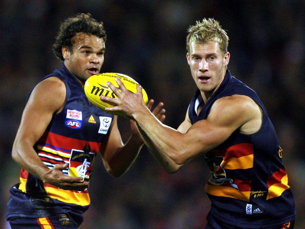 2006 - Scott Thompson breaks away as teammate Graham Johncock looks on during a match at AAMI Stadium against North Melbourne