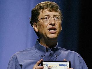  Microsoft Chairman Bill Gates holds a model of an concept mobile PC on April 25, 2005 in Seattle that he said was a futuristic 