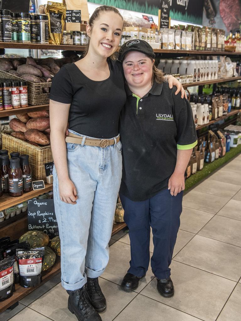 Gabe Hoopert (right) enjoys her job at The Paddock helped by her support worker Jemma Melia. Tuesday, October 26, 2021. Picture: Nev Madsen.