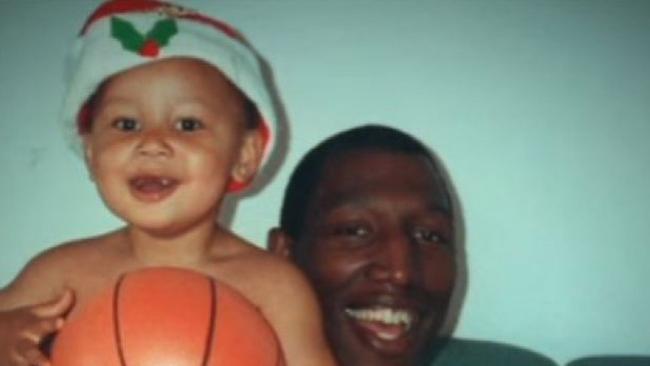 Ben Simmons as a baby with his father.