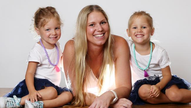 Victoria Rozkowicz and 3-year-old twins Charlotte (l) and Annabelle (r). Picture: NIGEL HALLETT