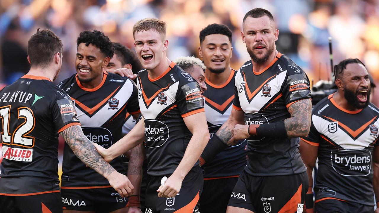 SYDNEY, AUSTRALIA - APRIL 01: Lachlan Galvin of the Tigers celebrates victory with teammates after the round four NRL match between Parramatta Eels and Wests Tigers at CommBank Stadium, on April 01, 2024, in Sydney, Australia. (Photo by Matt King/Getty Images)