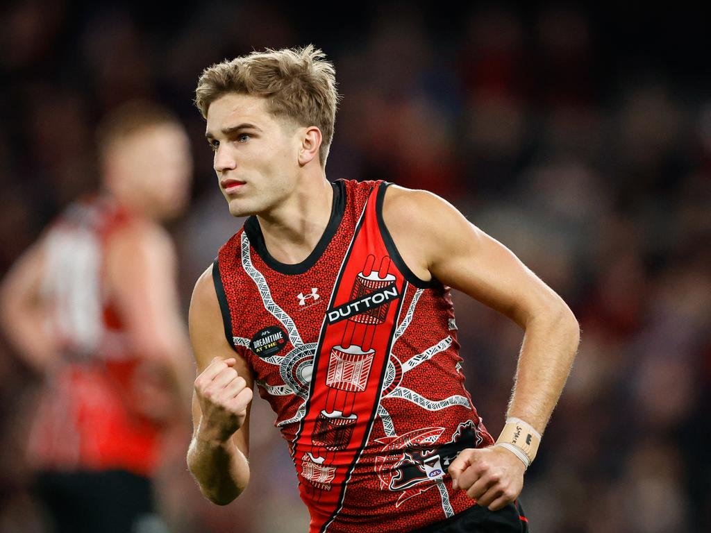 MELBOURNE, AUSTRALIA - MAY 19: Matt Guelfi of the Bombers celebrates a goal during the 2024 AFL Round 10 match between the Essendon Bombers and the North Melbourne Kangaroos at Marvel Stadium on May 19, 2024 in Melbourne, Australia. (Photo by Dylan Burns/AFL Photos via Getty Images)