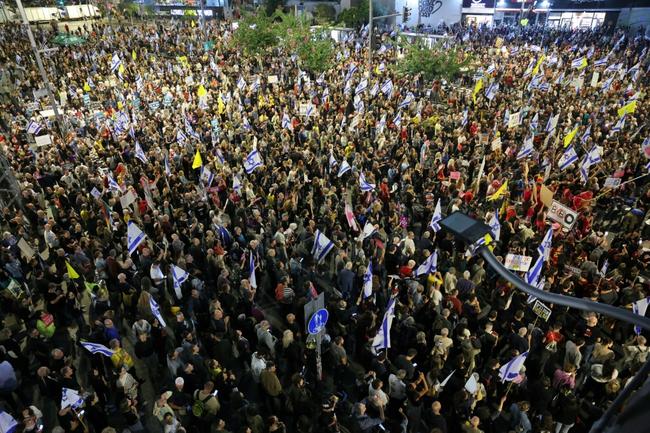 Demonstrators in front of the Israeli Defence Ministry in Tel Aviv call for action to secure the release of Israeli hostages held captive since the October 7, 2023 attack by Palestinian militants