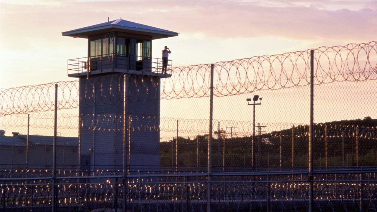 Qld prison facilities in stage four lockdown after officer tests positive