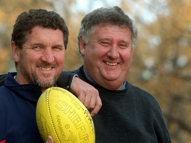 Roy Laird was a big fan of Peter Jonas while growing up as a Central District fan and Jonas, pictured with long-time Bulldogs general manager Kris Grant (right) went on to coach the club’s first flag in 2000.