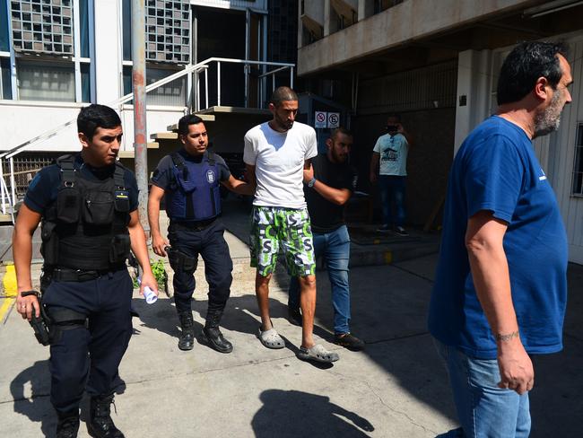 Gilad Pereg is led away by police. Picture: The Mendoza Post 