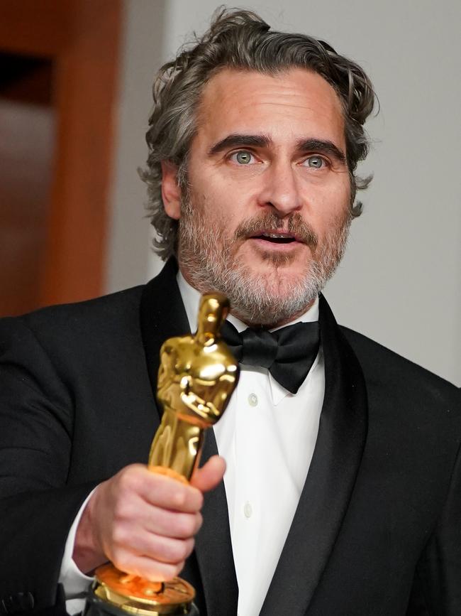 Phoenix with his 2020 Oscar for Joker. Picture: Getty