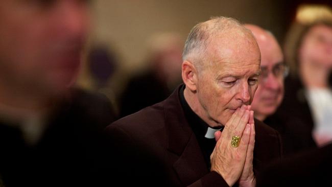 (FILES) In this file photo taken on November 11, 2002, Archbishop of Washington Cardinal Theodore McCarrick prays during a prayer for deceased bishops at the start of the morning session of the US Conference of Catholic Bishops being held in Washington, DC.  Pope Francis has accepted the resignation of Cardinal  McCarrick, who is accused of sexually abusing a teenager nearly five decades ago, the Vatican said on July 28, 2018. McCarrick, the former archbishop of Washington, was removed from the ministry in June after a review board found there was 
