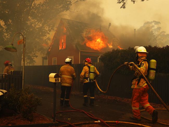 Firefighters try desperately to save homes in Balmoral. Picture: Sam Ruttyn