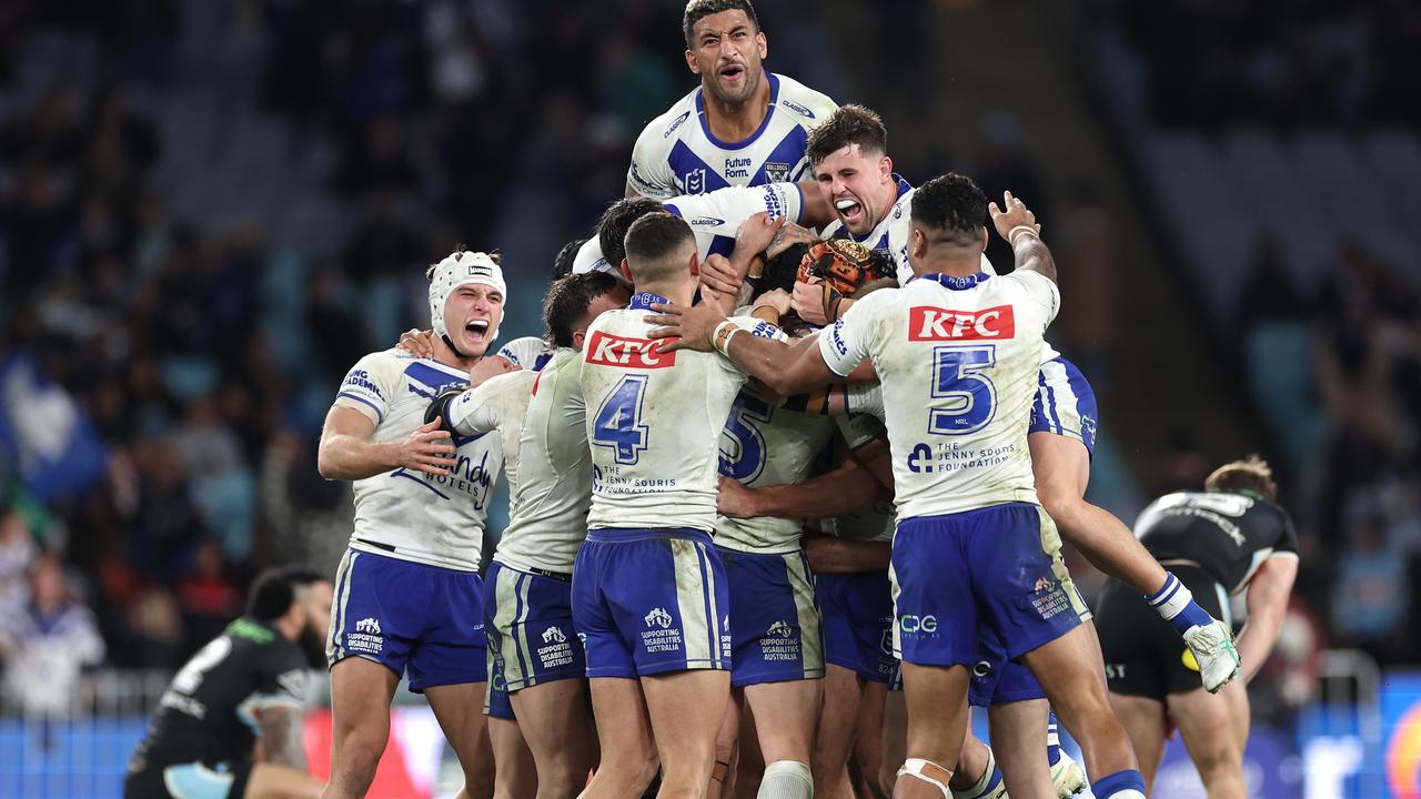 SYDNEY, AUSTRALIA - JUNE 28:  Matt Burton of the Bulldogs celebrates with team mates after kicking a golden point field goal in extra time to win the round 17 NRL match between Canterbury Bulldogs and Cronulla Sharks at Accor Stadium on June 28, 2024, in Sydney, Australia. (Photo by Cameron Spencer/Getty Images)