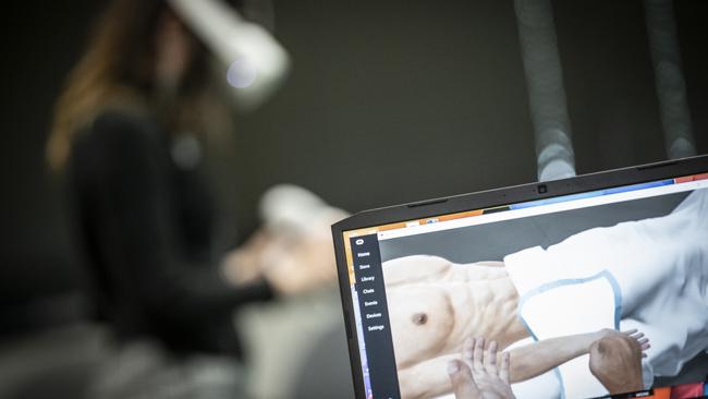 Shannon Woodhead, a University of Wollongong medical student, practises collecting blood in a virtual reality module. Picture: Supplied