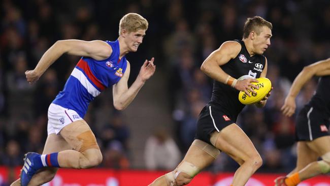 Western Bulldogs ruckman Tim English charges after Patrick Cripps. Picture: Michael Klein.