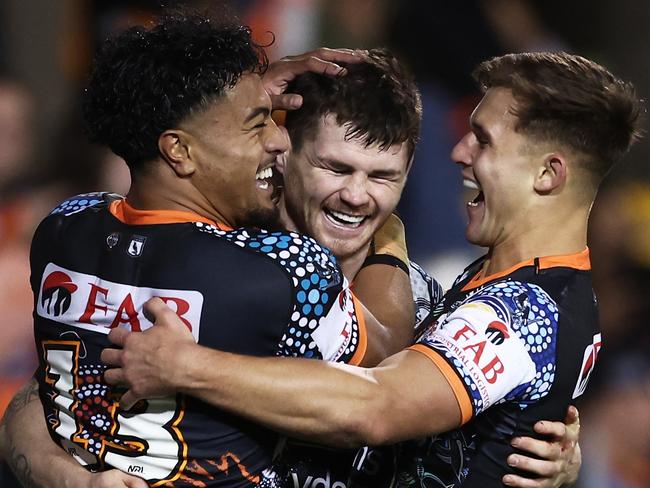 SYDNEY, AUSTRALIA - MAY 20:  John Bateman of the Tigers celebrates with team mates after scoring a try during the round 12 NRL match between Wests Tigers and North Queensland Cowboys at Leichhardt Oval on May 20, 2023 in Sydney, Australia. (Photo by Matt King/Getty Images)