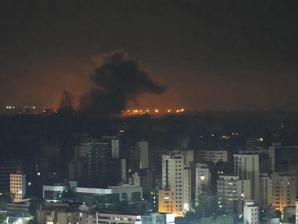 Smoke rises after an Israeli airstrike that targeted a neighborhood in Beirutâs southern suburbs on October 5, 2024. Israel's military launched an intensified wave of strikes on Hezbollah strongholds around Lebanon, killing more than 1,110 people since September 23, and forced hundreds of thousands to flee their homes in a country already mired in economic crisis. (Photo by ETIENNE TORBEY / AFP)