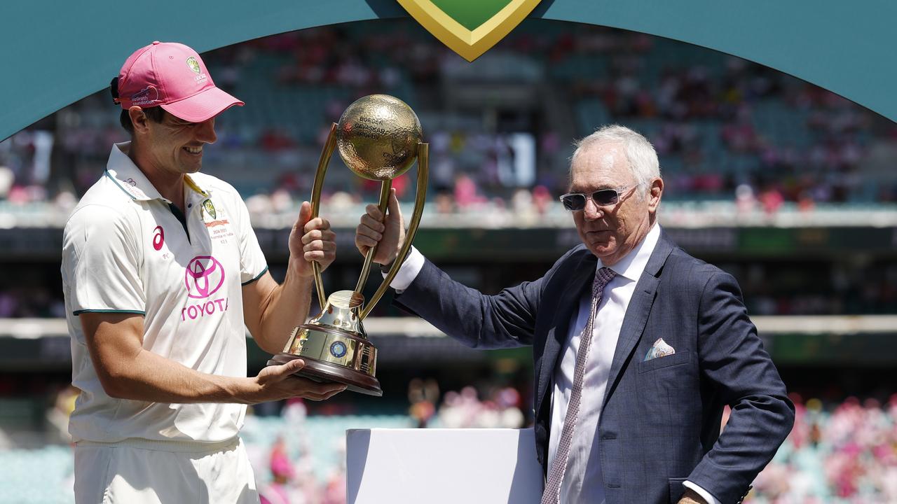 Pat Cummins receives the Border Gavaskar Trophy from Allan Border. (Photo by Darrian Traynor/Getty Images)