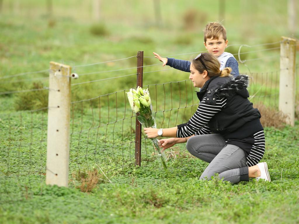 Felicity Southworth places flowers at the property. Picture: Tait Schmaal