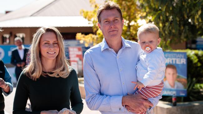 Liberal candidate for Pearce, Christian Porter arrives with his daughter Florence and wife, Jen at Ellen Stirling Primary School on Election Day in Perth. Picture: AAP Image/Richard Wainwright