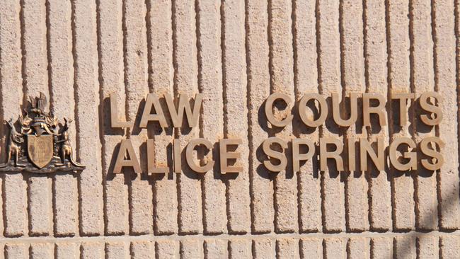 A Northern Territory policeman walks in front of the Alice Springs Local Court. Picture: Gera Kazakov