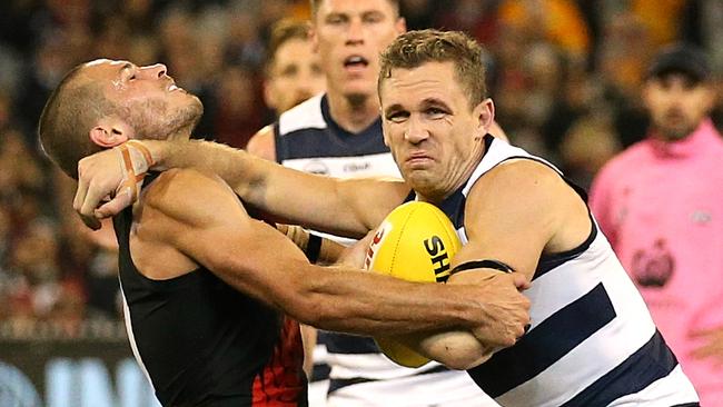 Joel Selwood gives away a free kick as he tries to shrug a tackle. Picture: Wayne Ludbey