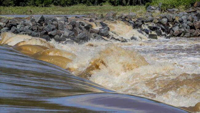 Water flowing over the Oxenford weir after the recent heavy rainfall. Picture: Jerad Williams