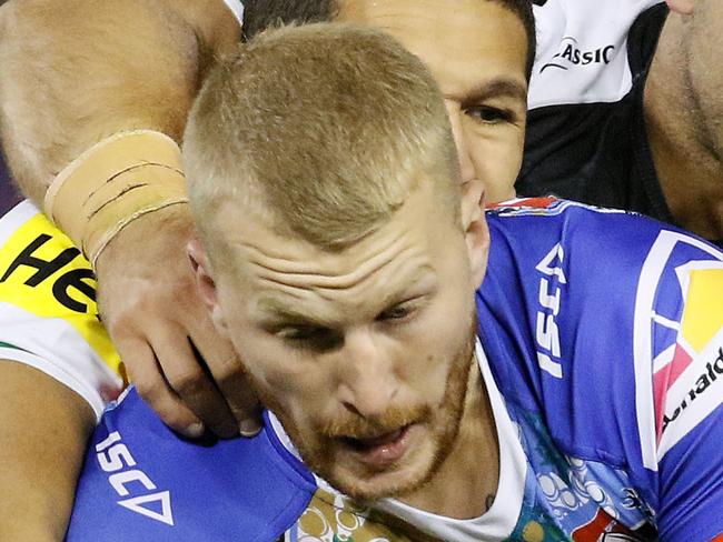 Mitchell Barnett of the Knights is tackled during the Round 10 NRL match between the Newcastle Knights and the Penrith Panthers at McDonald Jones Stadium in Newcastle, Friday, May 11, 2018. (AAP Image/Darren Pateman) NO ARCHIVING, EDITORIAL USE ONLY