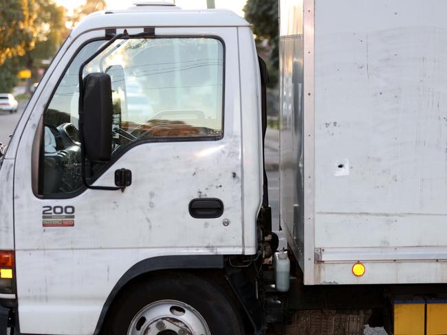 A bullet hole in a truck in Chester Hill, near a at a crime scene where a shooting occurred. Picture: Damian Shaw