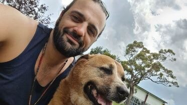 Tim Bow with his dog 'Amber' who recently passed.