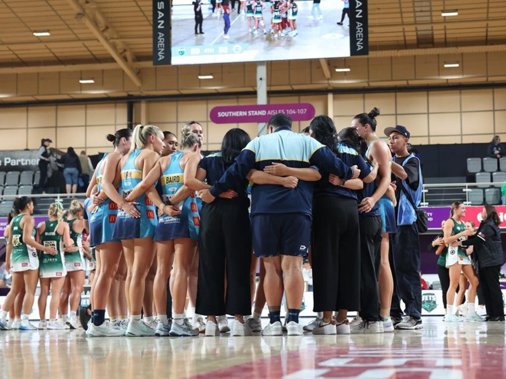 Gold Coast Titans Netball Sapphire series side 2024 huddles on court of the grand final