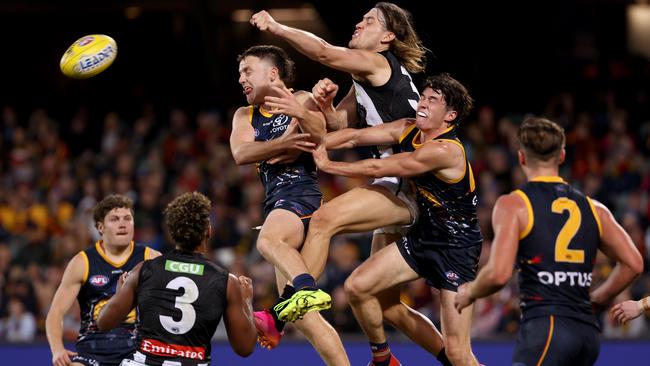 Moore flies for a spoil for Collingwood. Picture: James Elsby/AFL Photos via Getty Images