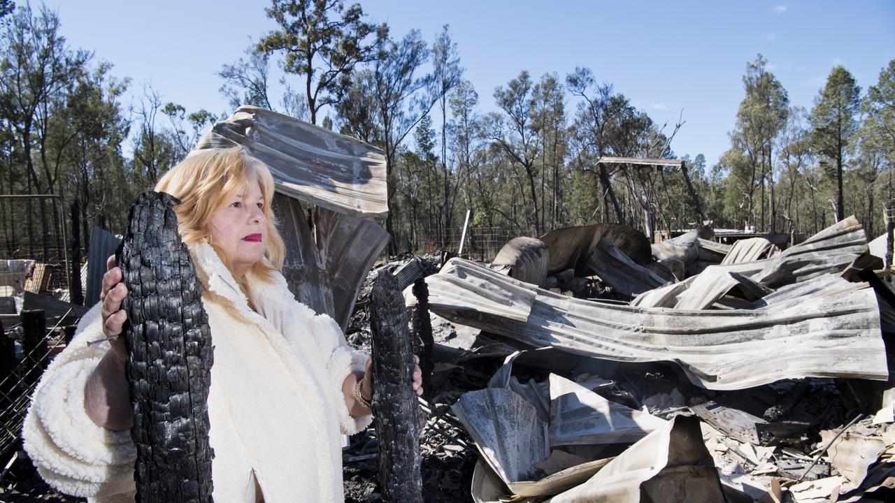 Katherine Greeves looks at her house destroyed by fire in Gardenia Crescent, Millmerran Downs. Wednesday, 15th Jul, 2020.