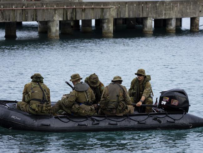 Australian Army soldiers from 3rd Battalion, Royal Australian Regiment and Papua New Guinea Defence Force soldiers from 2nd Royal Pacific Island Regiment provide an outer cordon during a clearance at the Port of Wewak, Papua New Guinea during Exercise Wantok Warrior 24. PHOTO: PTE Jessica Gray