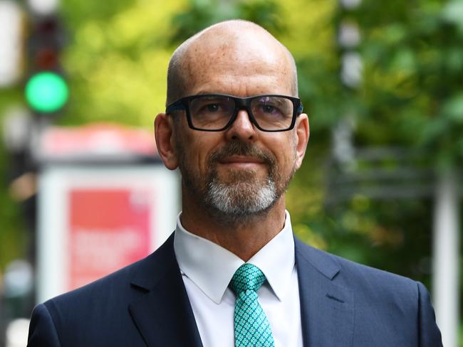 Former Victoria Police Chief Commissioner Simon Overland arrives to the Royal Commission into the Management of Police Informants at the Fair Work Commission in Melbourne, Tuesday, December 17, 2019. (AAP Image/James Ross) NO ARCHIVING