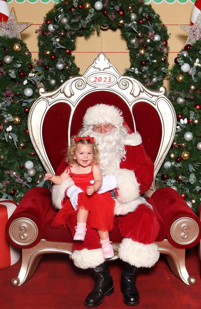 Norah Lewin with Santa: Canelands Central 2023 - Mackay. Sent in by her grandmother, Karen Carvolth.