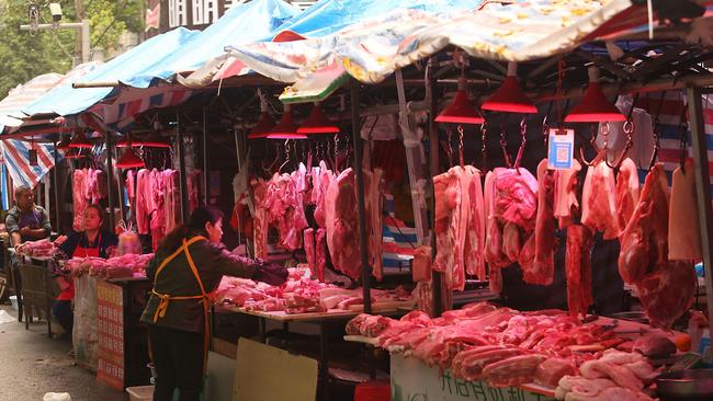 Fresh pork is sold at a neighborhood wet market in Wuhan, the capital of Hubei Province. Picture: Alamy