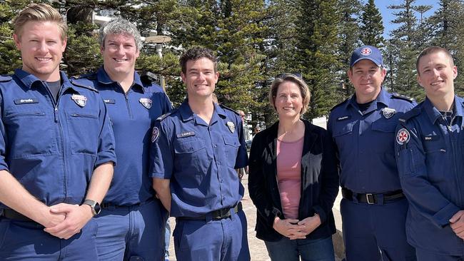 Katherine Smith (centre), of Kurraba Point, on Tuesday, with NSW Ambulance paramedics, left to right, Brodie, Paul, Locky, Christian and Max, who helped save her life after she stopped breathing while on an early morning swim from Manly to Shelly Beach. Picture: NSW Ambulance