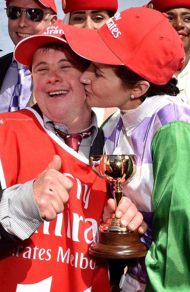 Winning Melbourne Cup jockey Michelle Payne gives brother Stevie Payne a kiss after her triumph on Prince Of Penzance. Picture: Jay Town