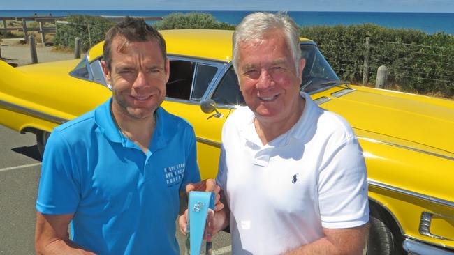 Gerry Ryan and Cadel Evans with the Gerry Ryan Trophy and the yellow Cadillac Ryan gave him after his Tour De France win.