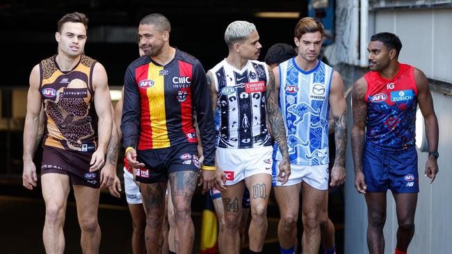 MELBOURNE, AUSTRALIA - MAY 13: Players emerge up the race during a Sir Doug Nicholls Round media opportunity at Melbourne Cricket Ground on May 13, 2024 in Melbourne, Australia. (Photo by Dylan Burns/AFL Photos via Getty Images)