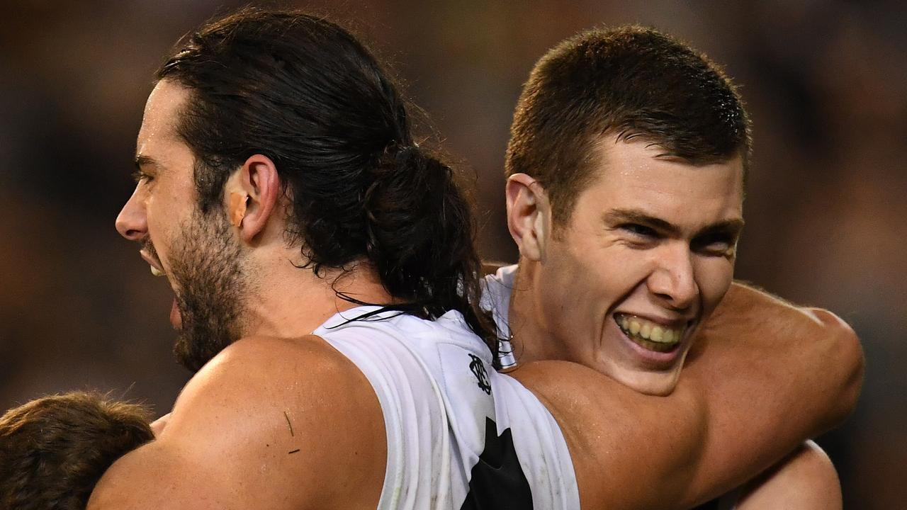 Brodie Grundy and Mason Cox react during Collingwood’s preliminary final win. (AAP Image/Julian Smith)