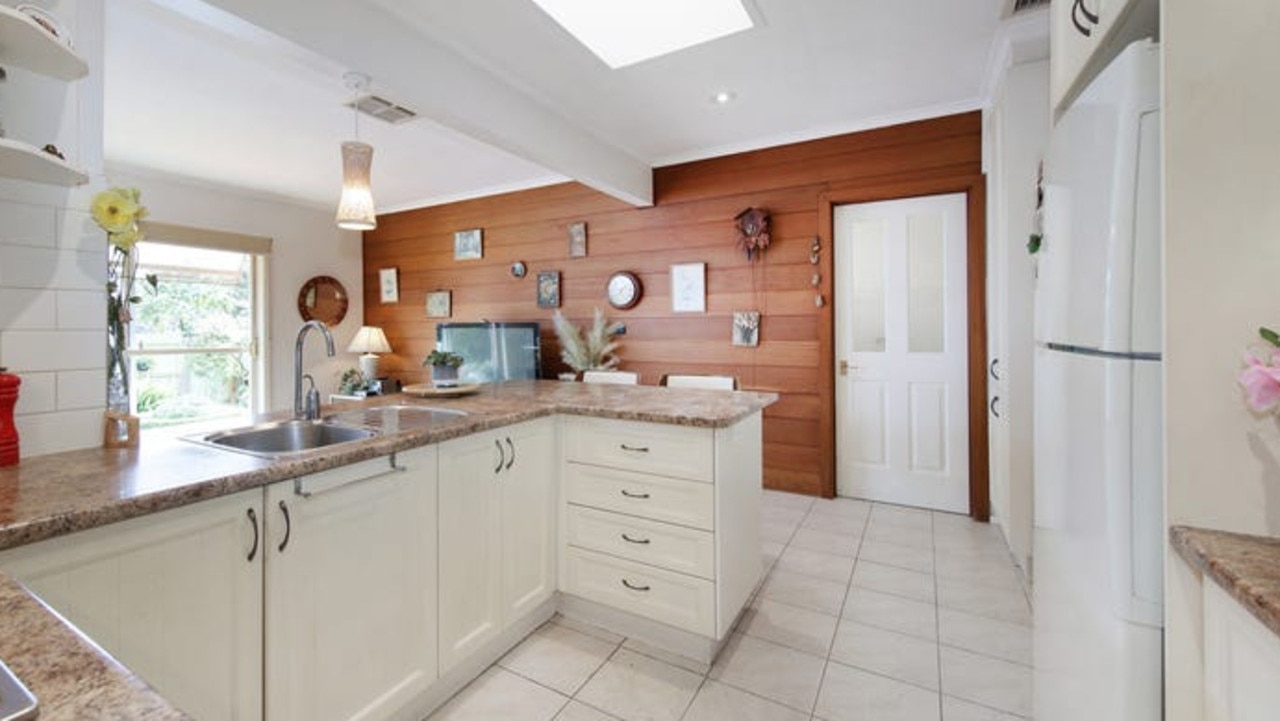 There’s plentiful cabinetry in the well-maintained home’s kitchen.