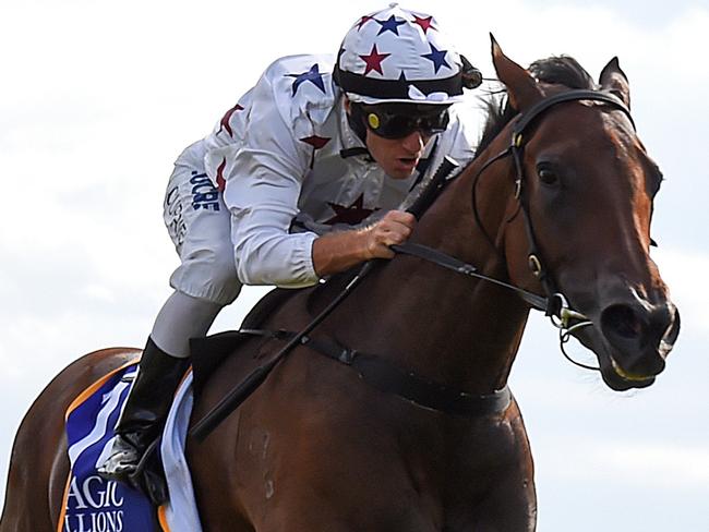 Jockey Luke Currie rides Sunlight (centre) to victory in Race 8, the Magic Millions Two-Years-Old Classic, during the Gold Coast Magic Millions at Aquis Park, Gold Coast Turf Club, Queensland, Saturday, January 13, 2018. (AAP Image/Albert Perez) NO ARCHIVING, EDITORIAL USE ONLY