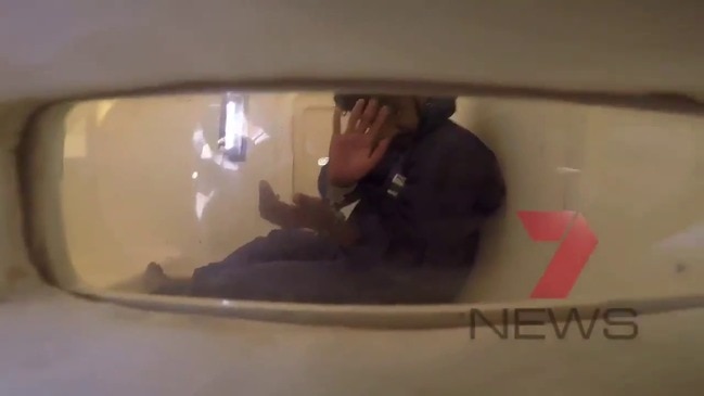 Accused murderer Bhanu Kirkman waves to cameras (7 News)